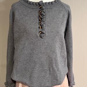 Grey button up sweater with buttons and ruffle detail